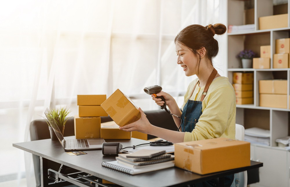 Happy,Excited,Start,Up,Business,Woman,Using,A,Barcode,Reader