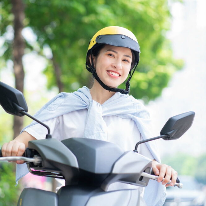 Photo,Of,Young,Asian,Woman,Driving,Motorbike