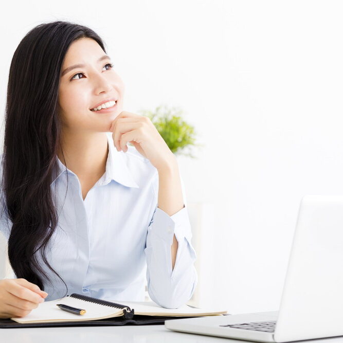 Beautiful,Business,Woman,Thinking,While,Working,On,Computer,At,Office